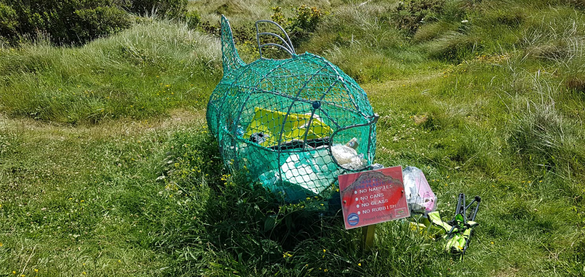 Wire fish for rubbish on the beach